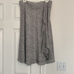 DKNY pocket dot midis skirt with ruffle embellishment.